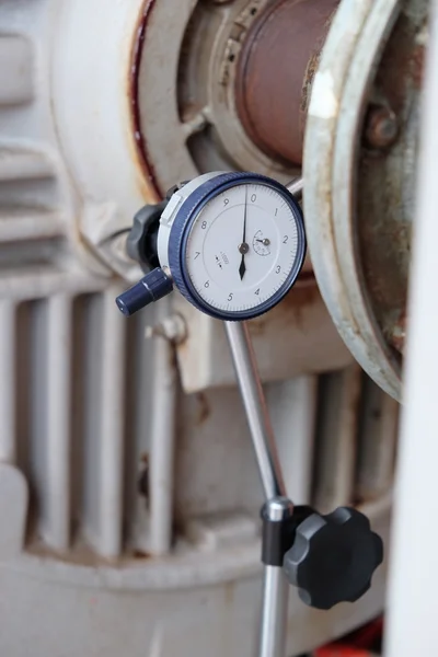 Worker set up Dial Indicator Gauge for alignment shaft.