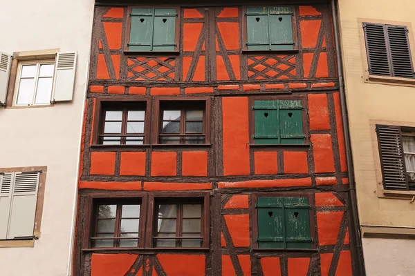 The front side of the  fachwerk house with wooden beams and  windows