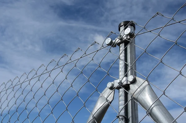 Solid metallic mesh fence closeup