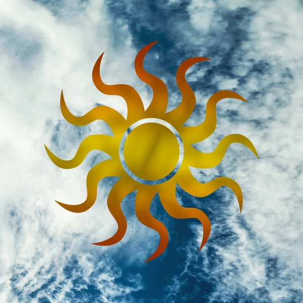The symbol of the sun against the blue sky and clouds