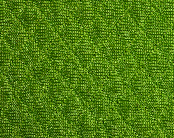 Green fabric texture with diamond pattern. Fabric texture with rhombuses. Closeup