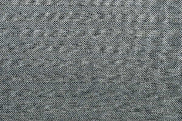 Light grey denim texture with oblique stripes and bands along the Fabric texture of jeans. Closeup