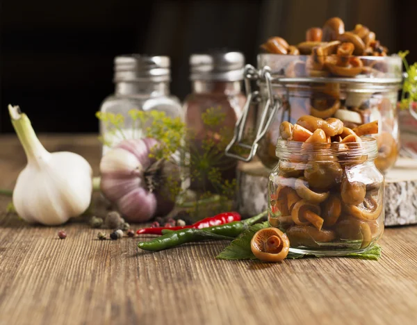 Saffron milk cap mushrooms pickled garlic dill and pepper in a bowl banks