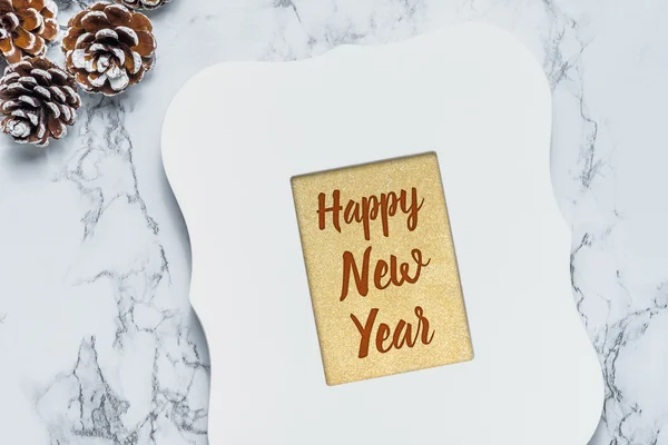 Happy New year text in gold glitter background in vintage white