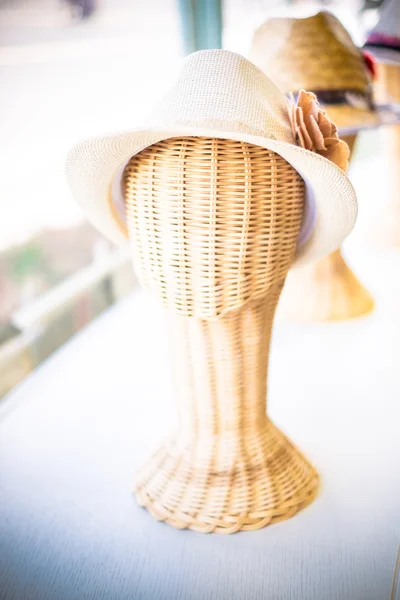 Lady hat on a wickerwork mannequin head