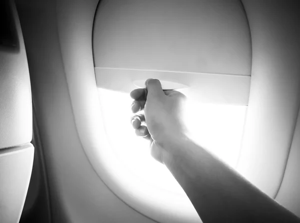 Hand Open the airplane window