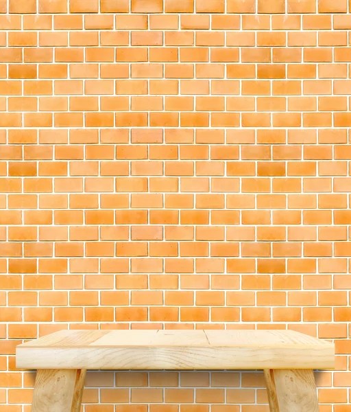 Empty wooden modern table on brick tiles wall,