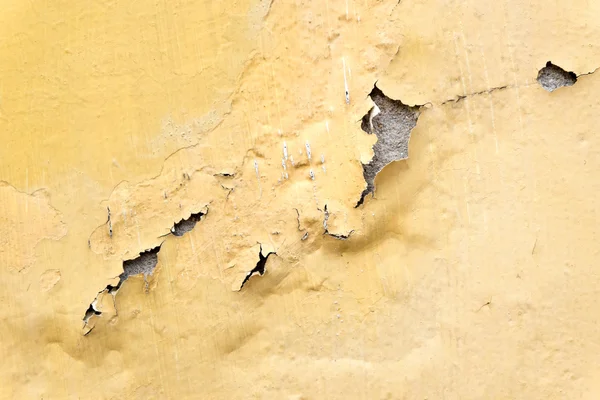 Yellow erode painted concrete wall