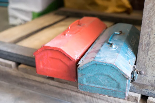 Grunge red and blue metal tool boxes