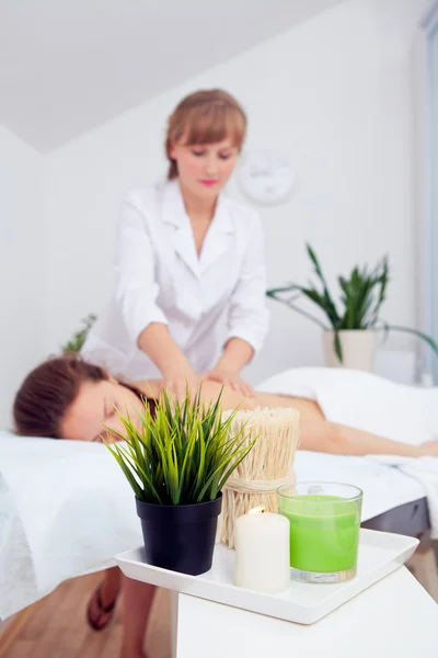 Spa Woman. Beauty Treatment. Beautiful Healthy Caucasian Girl Relaxing On Massage Table Before Procedure In The Spa Salon. Masseur Going To Massage Her Back. Body Care. Skin Care, Wellness, Wellbeing