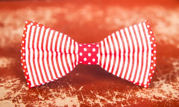 Red bow tie with stripes and polka dots