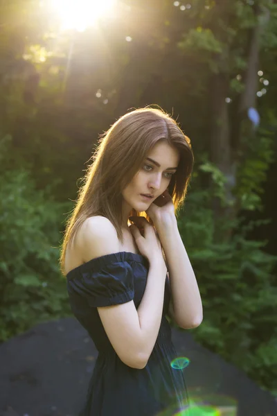 Sensual woman in the forest in summer