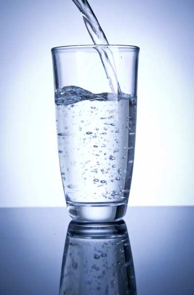 Glass of water being filled