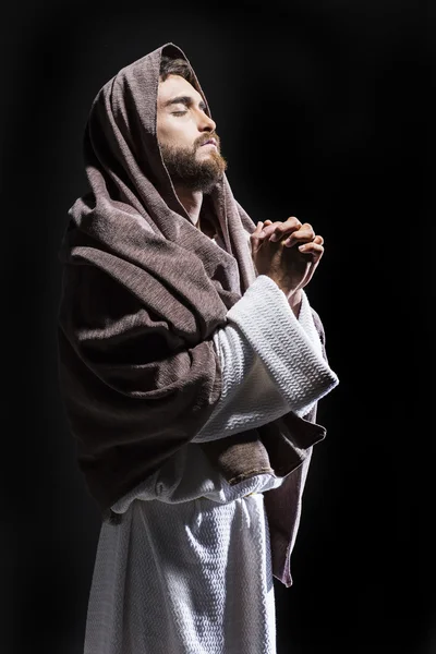 Jesus praying and consecrating