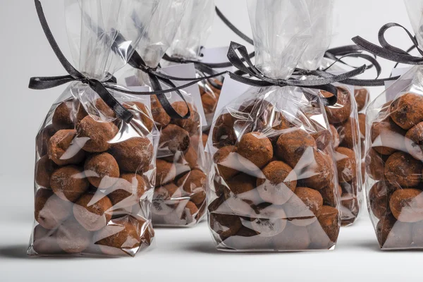 Luxury gifts with ribbon of chocolate truffles in a row