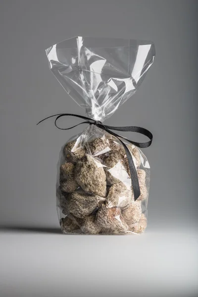 Luxury bag of dried figs isolated with elegant black ribbon