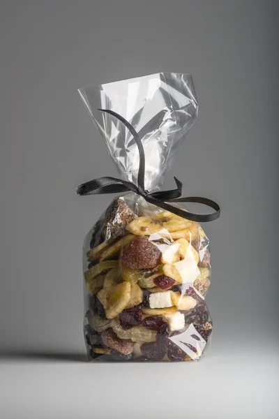 Mixed organic dried fruits into luxury transparent plastic bag