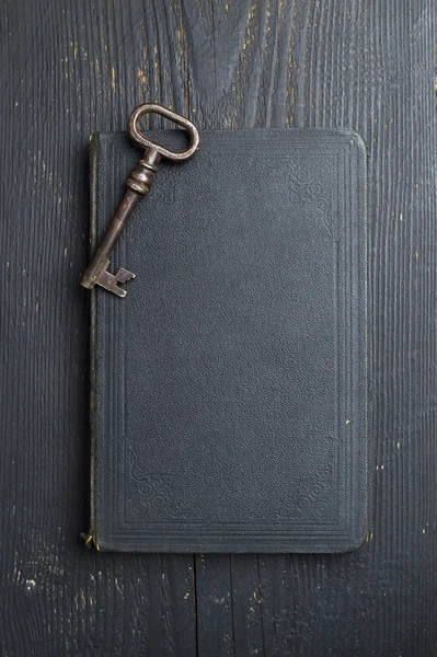 Vintage Key on black leather book