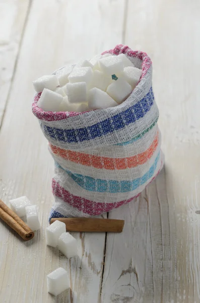 Cubes of sugar in canvas bag
