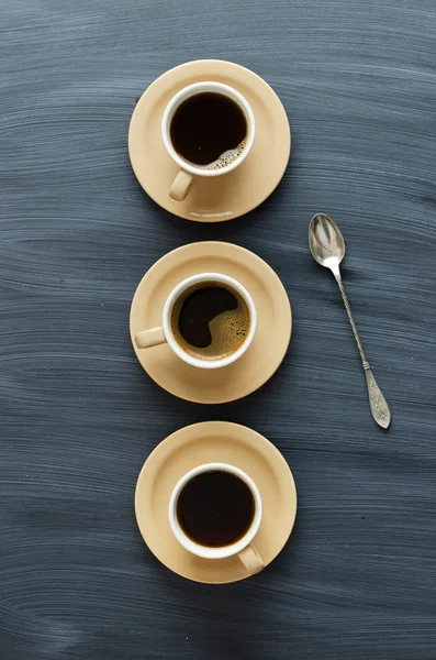 Coffee cups and a spoon