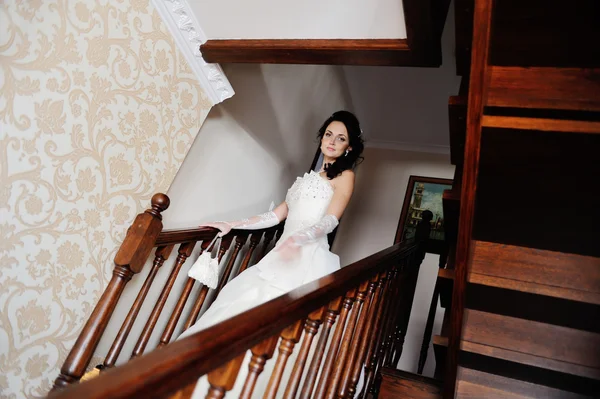 The bride walks down the stairs