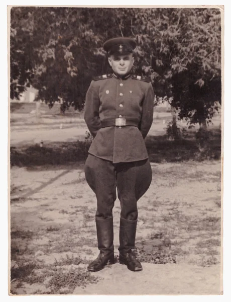 Sergeant of compulsory military service in military uniform (vintage photo, 1954)