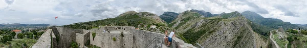 Panoramic views of walls of ancient fortress in Old Bar and New Bar at the foot of the mountains, Montenegro