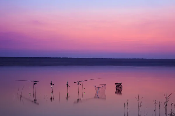 Fishing on the lake at sunset