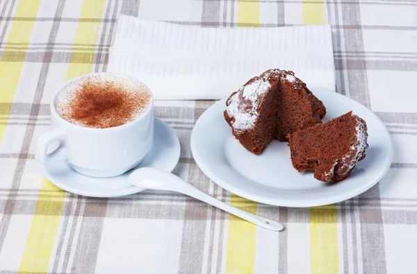 Cappuccino with cupcakes, tablecloth, cup