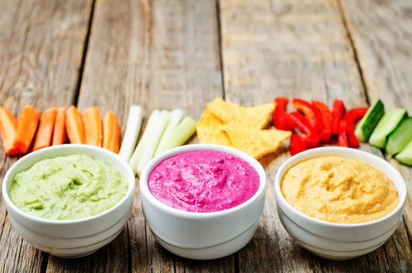 Multicolored vegetables beans hummus with vegetables and chips