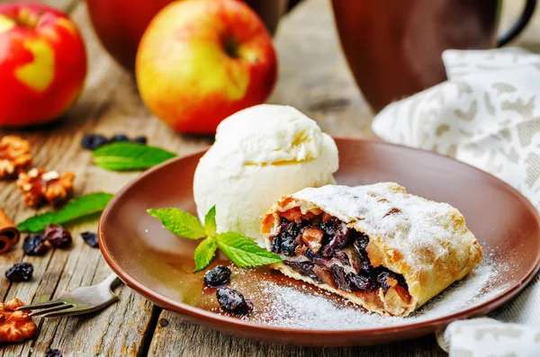 Apple strudel with nuts and raisins