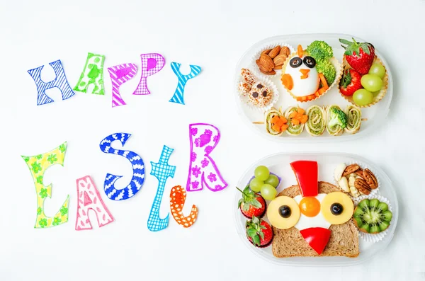 Happy Easter words with school lunch boxes for kids with food in