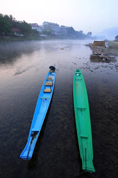 Two boats in small river