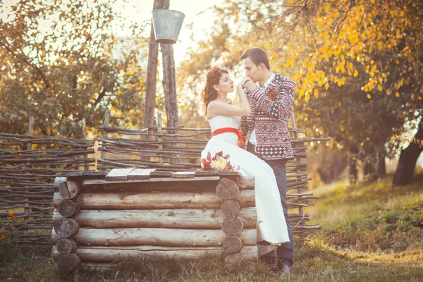 Newlyweds near the wooden well