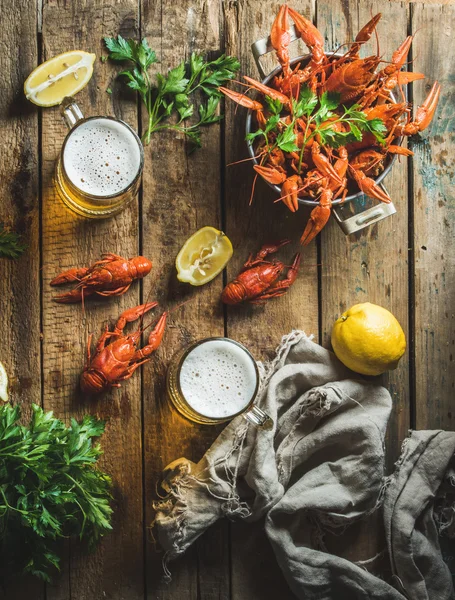 Wheat beer and boiled crayfish with lemon, parsley