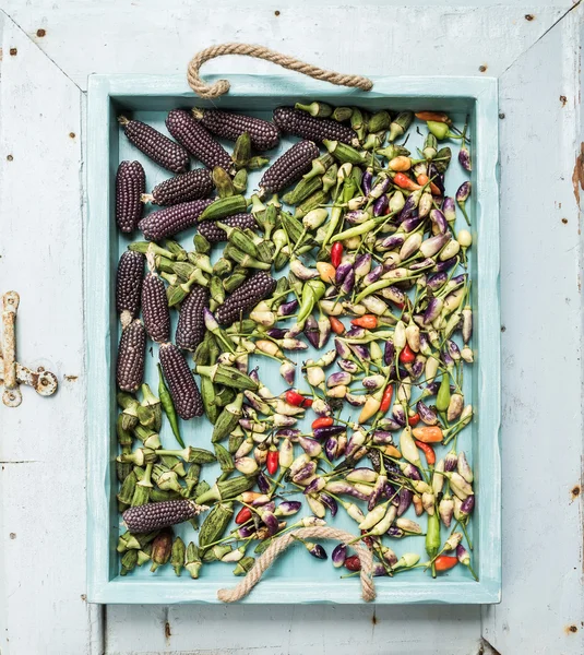 Okra, spicy peppers and small black corns