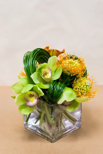 Floral arangement with Calla Lilies, cymbidium, protea and greenery