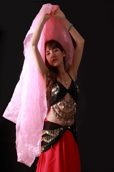 Belly dancer on black background