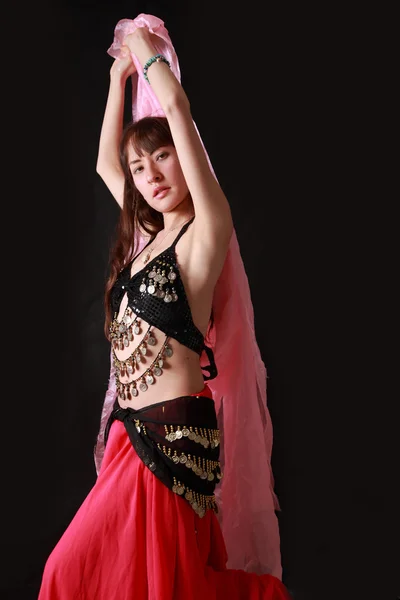 Belly dancer on black background