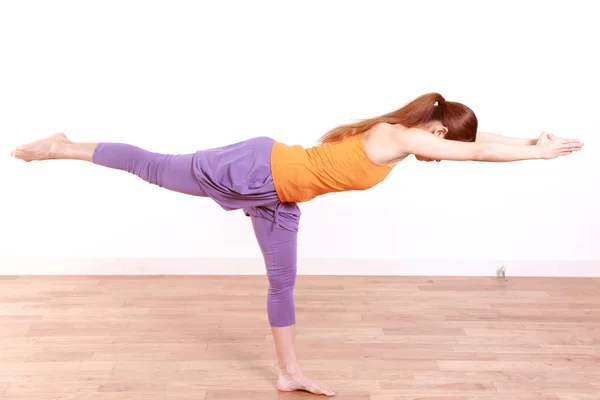 Young Japanese Woman Doing YOGA warrior 3 pose