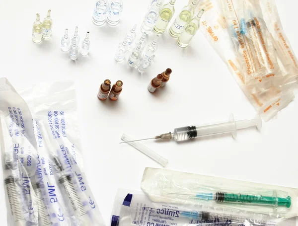 Medical bottles and pills on shelf