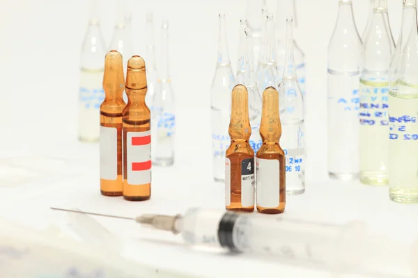 Medical bottles and pills on shelf