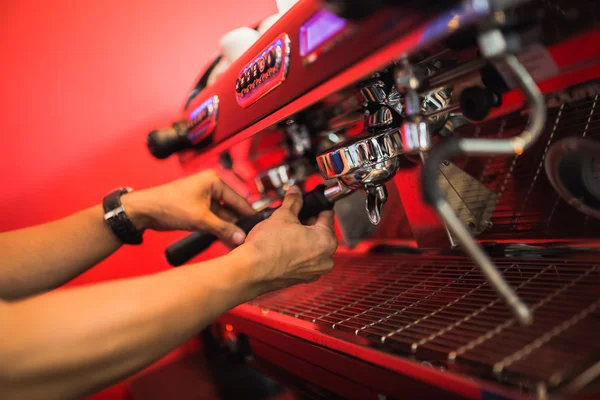 Hand of barista make coffee machine at coffee shop