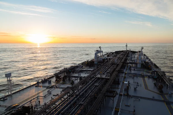Crude oil carrier during sunset.