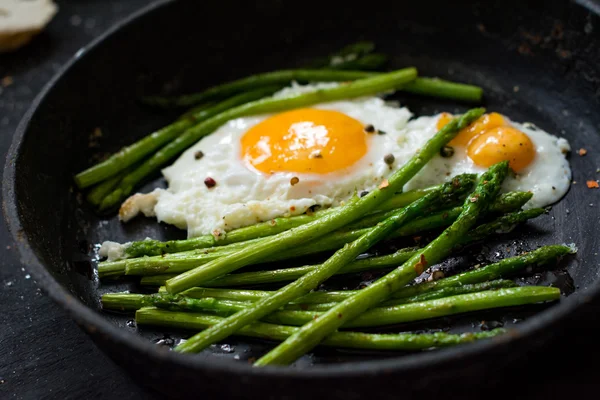 Green asparagus and eggs, breakfast meal