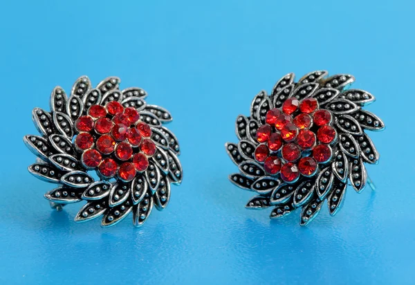 Silver jewelry with red stones inside