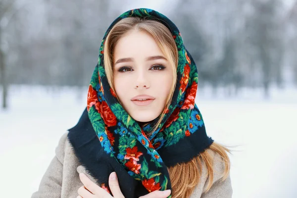 Portrait of a Russian woman in a winter snowy day.