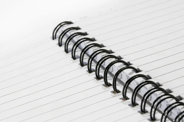 Close up of a spiral bound notebook with black spirals