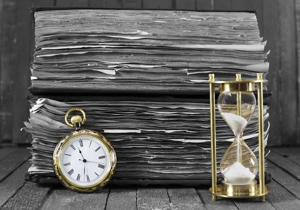 Still life with pocket watch and sand clock