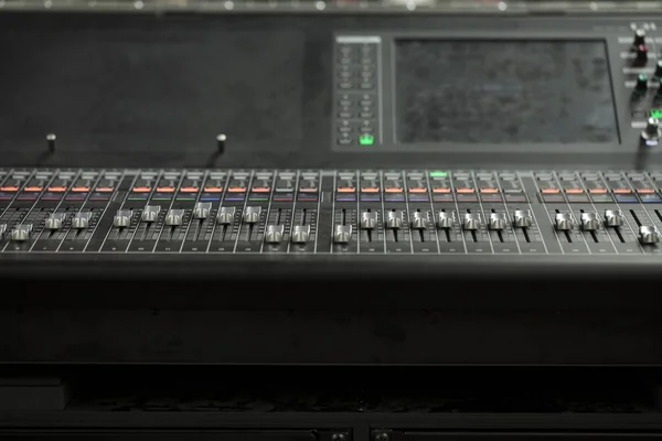 Music production console with dials and controls